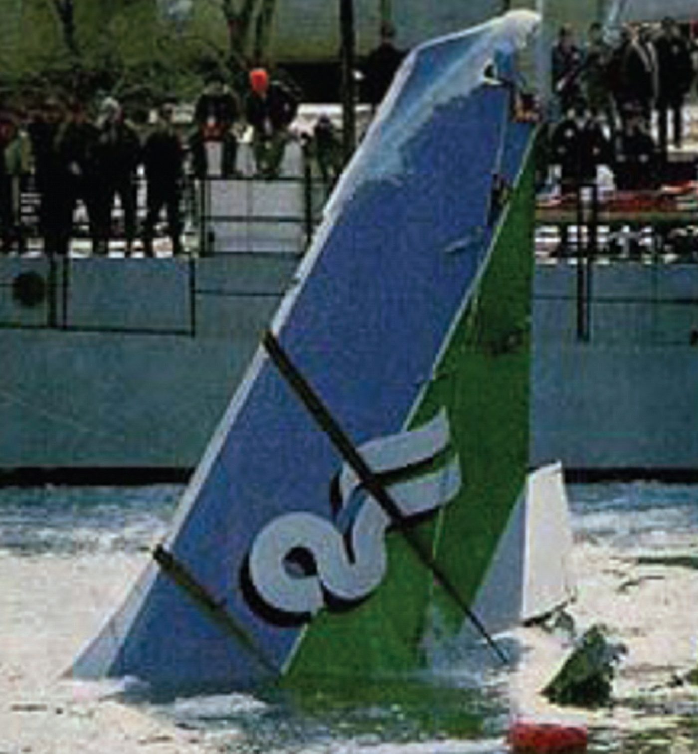 The tail section of Air Florida Flight 90 protruding from the icy Potomac River after the crash