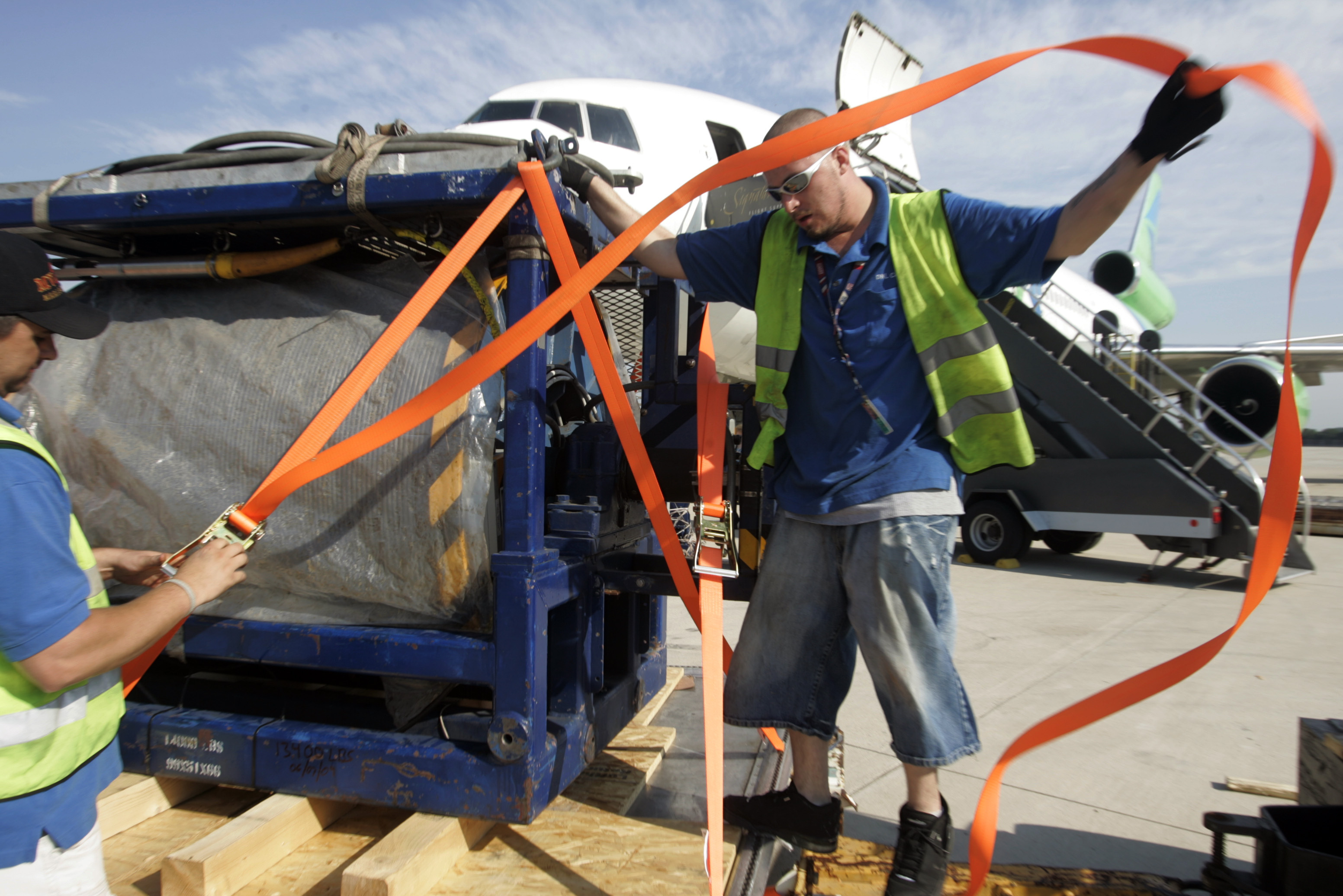 Ground crew at Dulles International Airport preparing U.S. Navy deep-sea search cable and salvage equipment for transport to Brazil to assist the Air France 447 search, June 2009