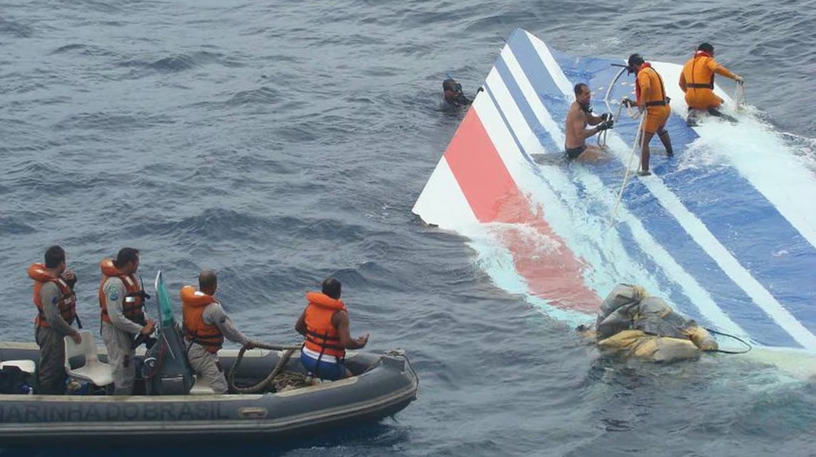 Brazilian Navy divers and sailors recovering the vertical stabilizer tail fin of Air France Flight 447 from the Atlantic Ocean, June 2009