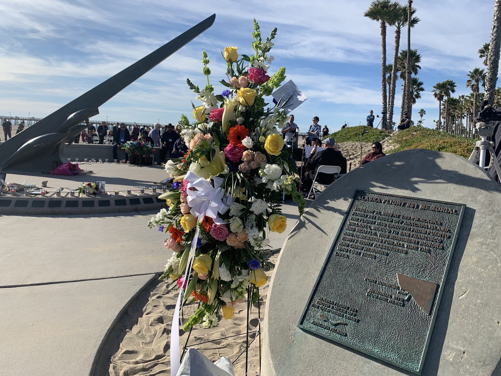 The Alaska Airlines Flight 261 memorial sundial at Port Hueneme, California, with flowers laid during the twentieth anniversary ceremony in February 2020