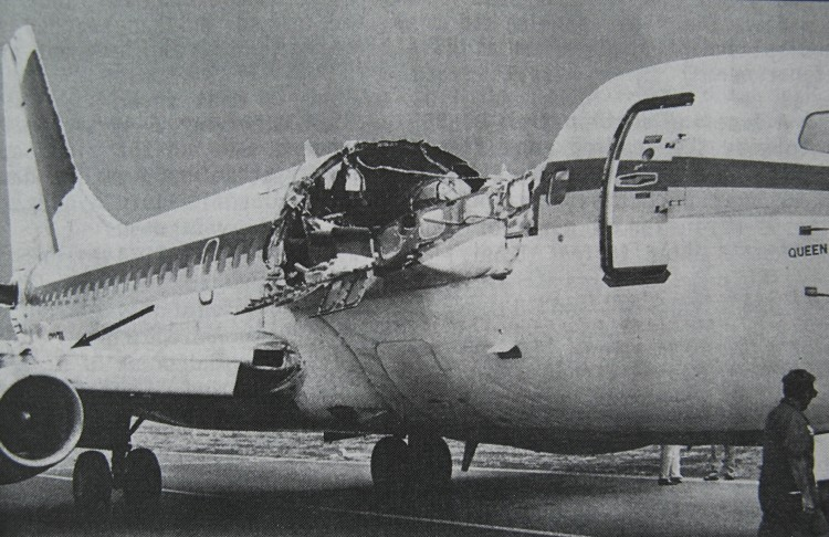 Aloha Airlines Flight 243 after landing, showing the 18-foot section of upper fuselage torn away, exposing the cabin to open sky