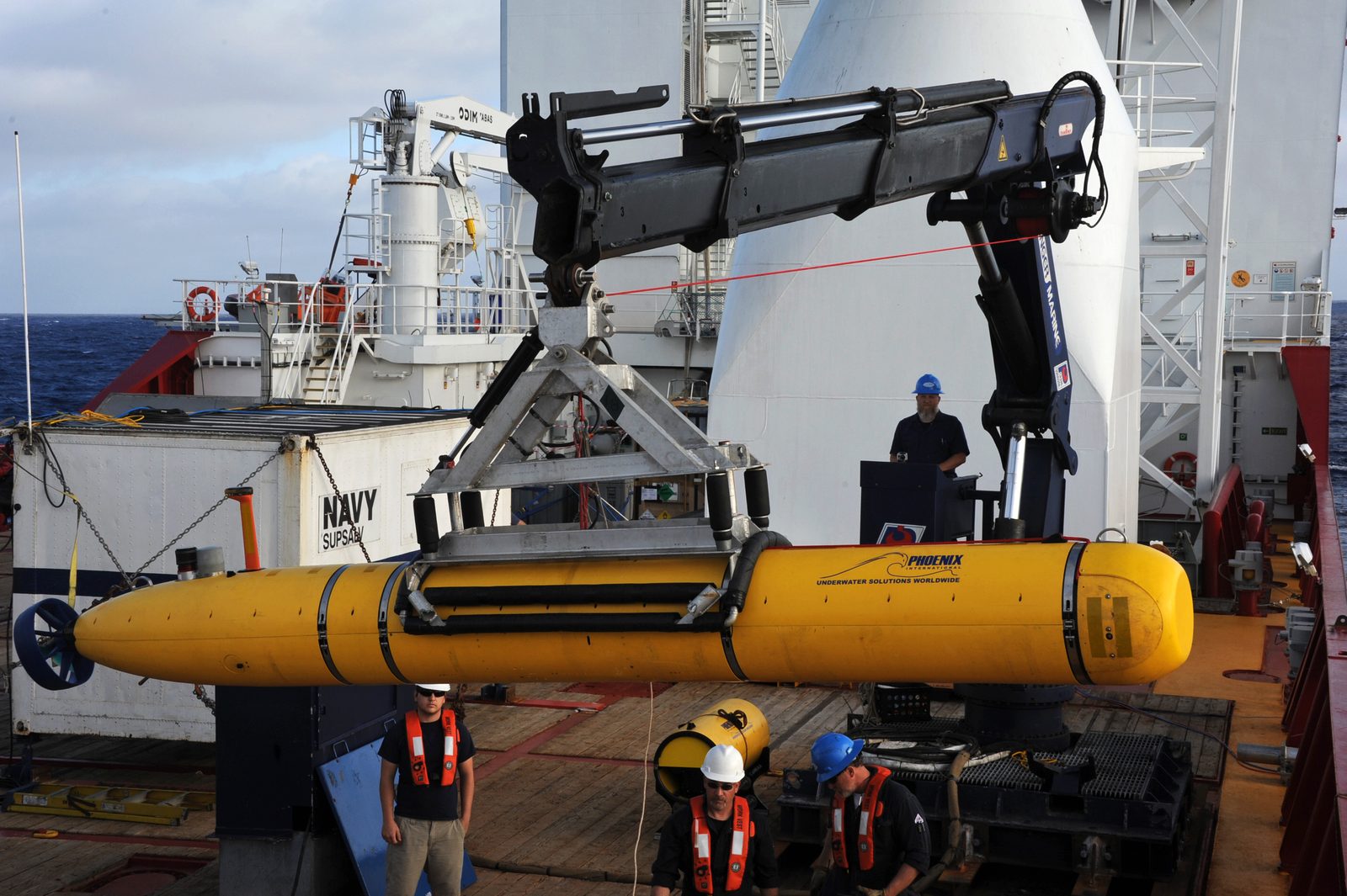 Crew aboard the ADF Ocean Shield moving the U.S. Navy's Bluefin-21 autonomous underwater vehicle into position for deployment during the search for MH370