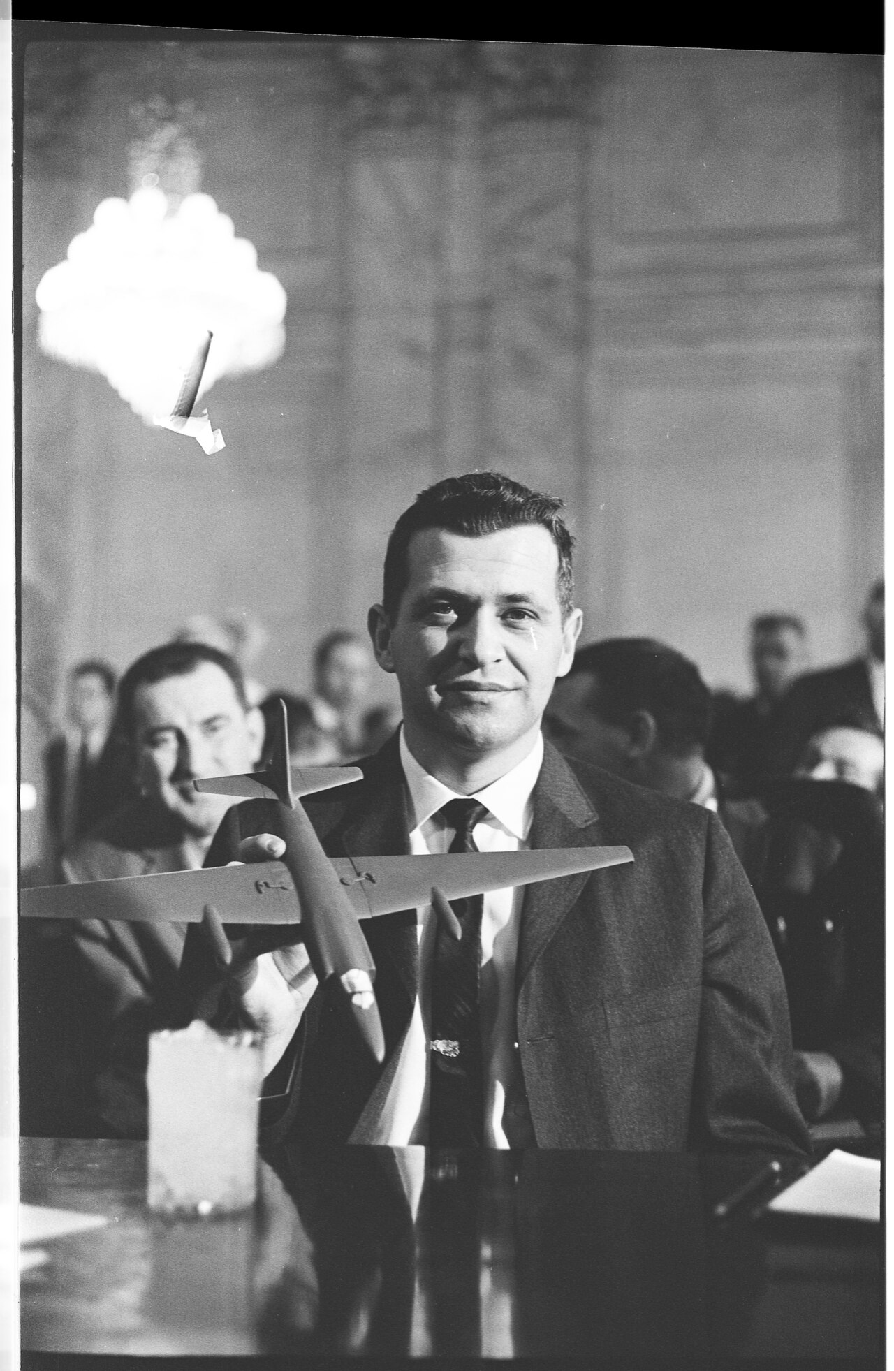 Francis Gary Powers holding a model U-2 aircraft while testifying before the Senate Armed Services Committee, March 6, 1962
